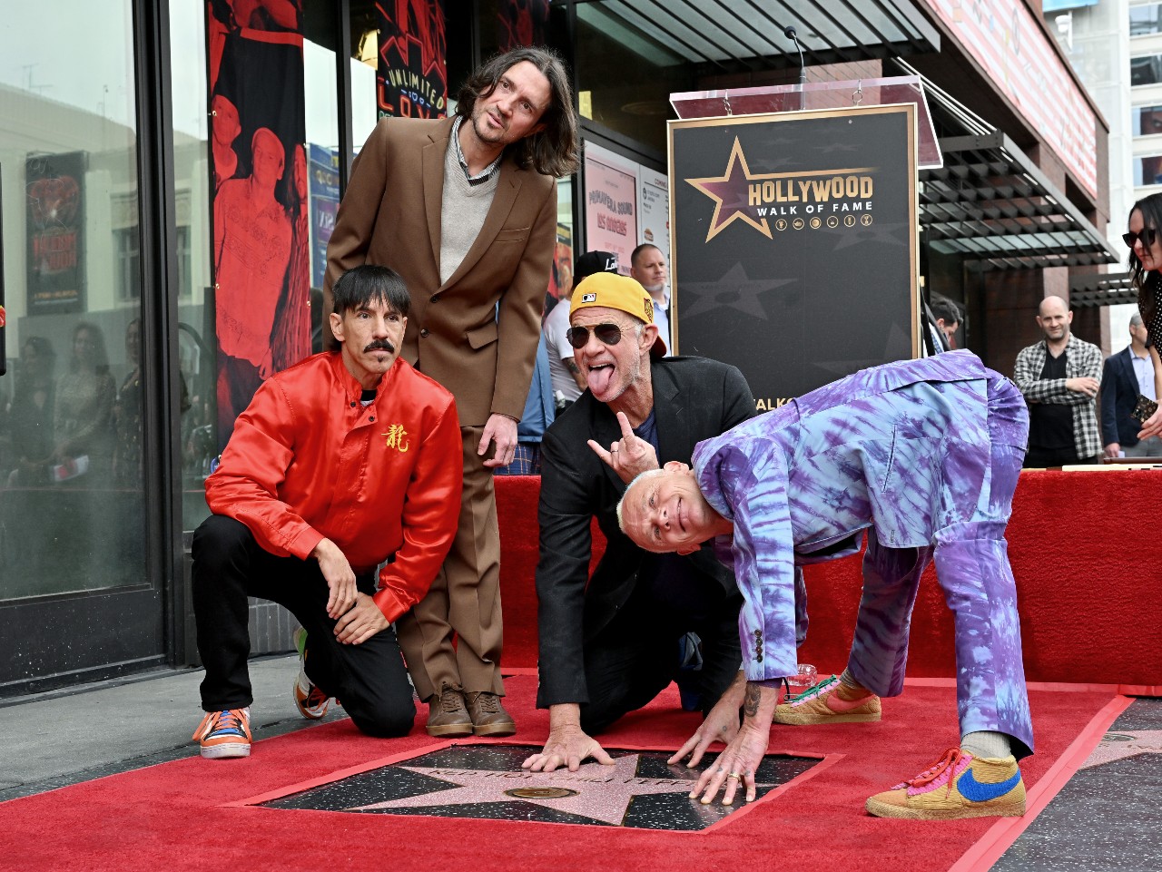 The Red Hot Chili Peppers pose in front of their star on the Hollywood Walk of Fame in March 2022.