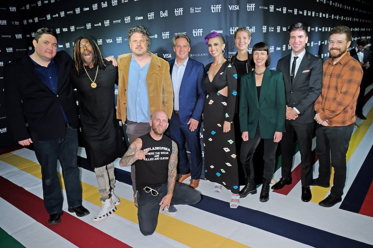 Tyler MacIntyre, Flying Lotus, Johannes Roberts, Josh Goldbloom, Michael Schreiber, Maggie Levin, Emily Gotto, Vanessa Winter, Nicholas Lazo, and Joseph Winter attend the V/H/S/99 premiere at the 2022 Toronto International Film Festival