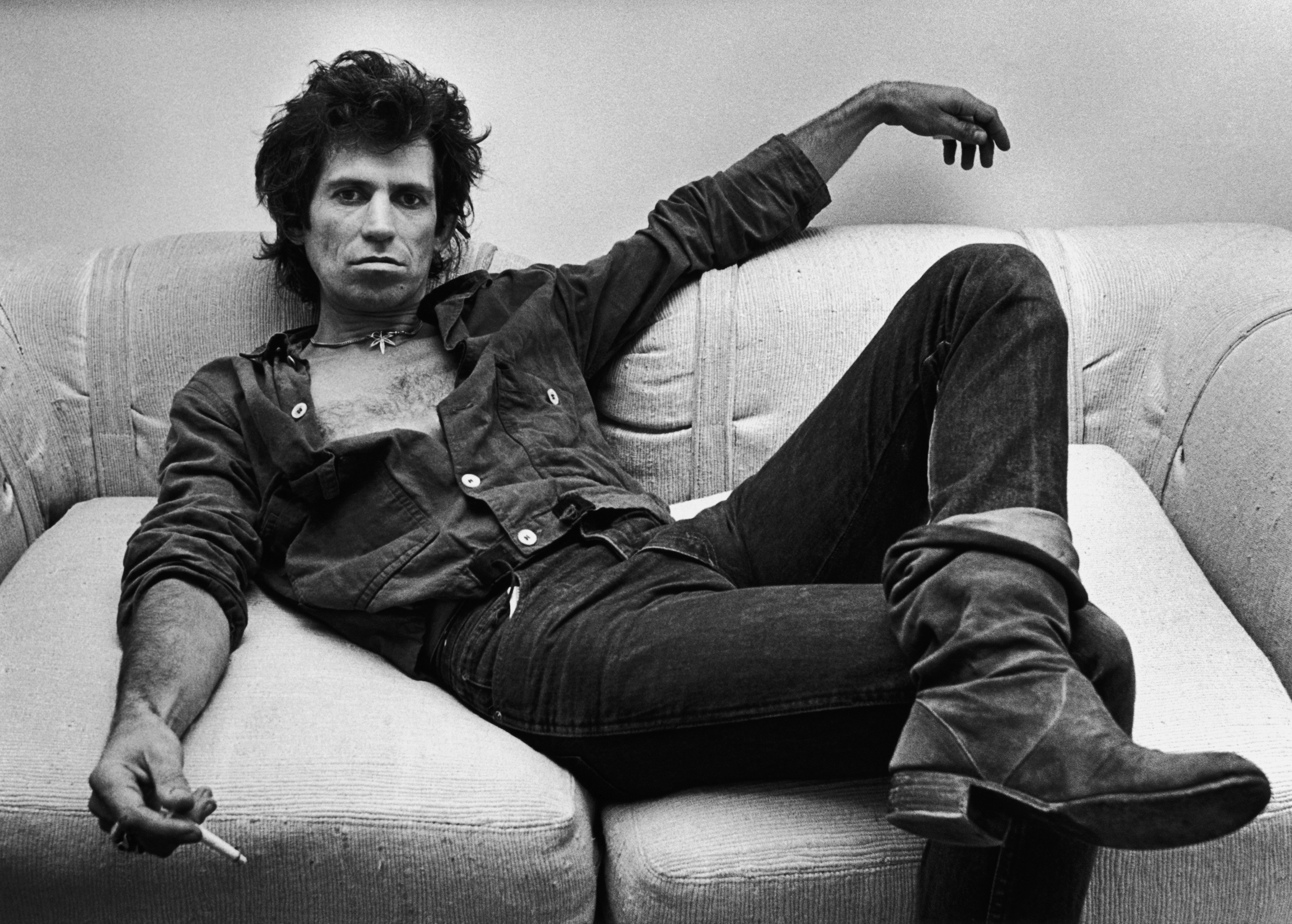 Keith Richards of The Rolling Stones on a couch