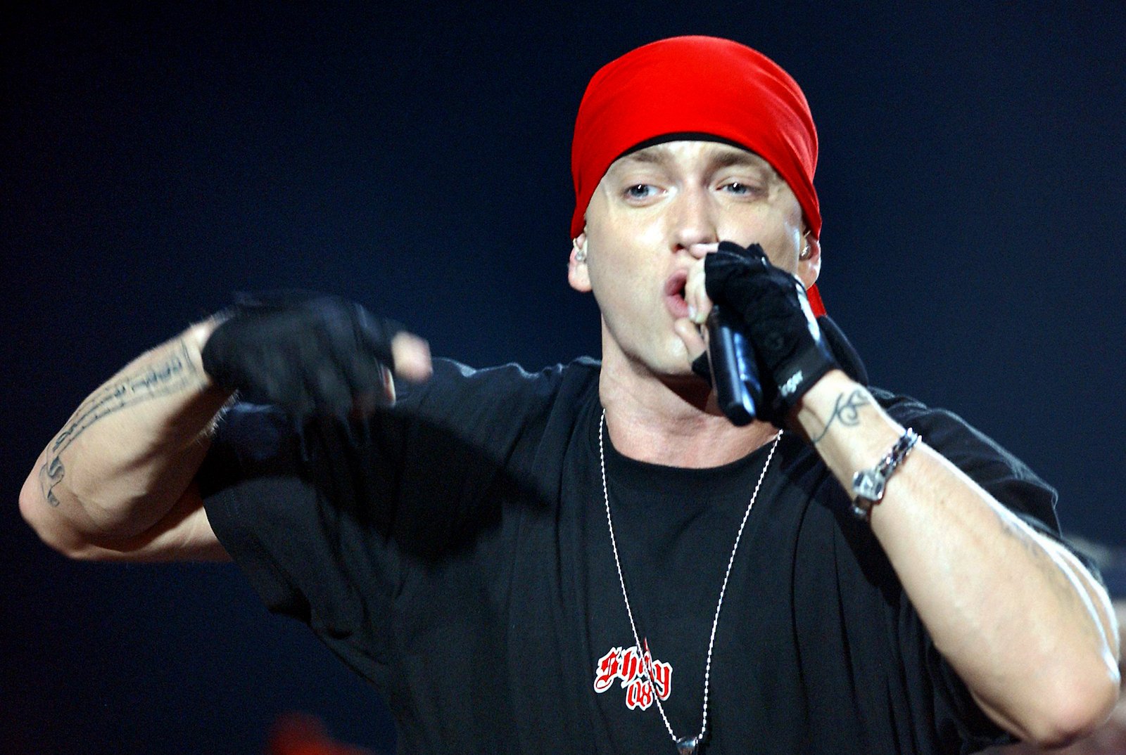 Eminem, who struggled with addiction for years, performing in a red beanie and black gloves