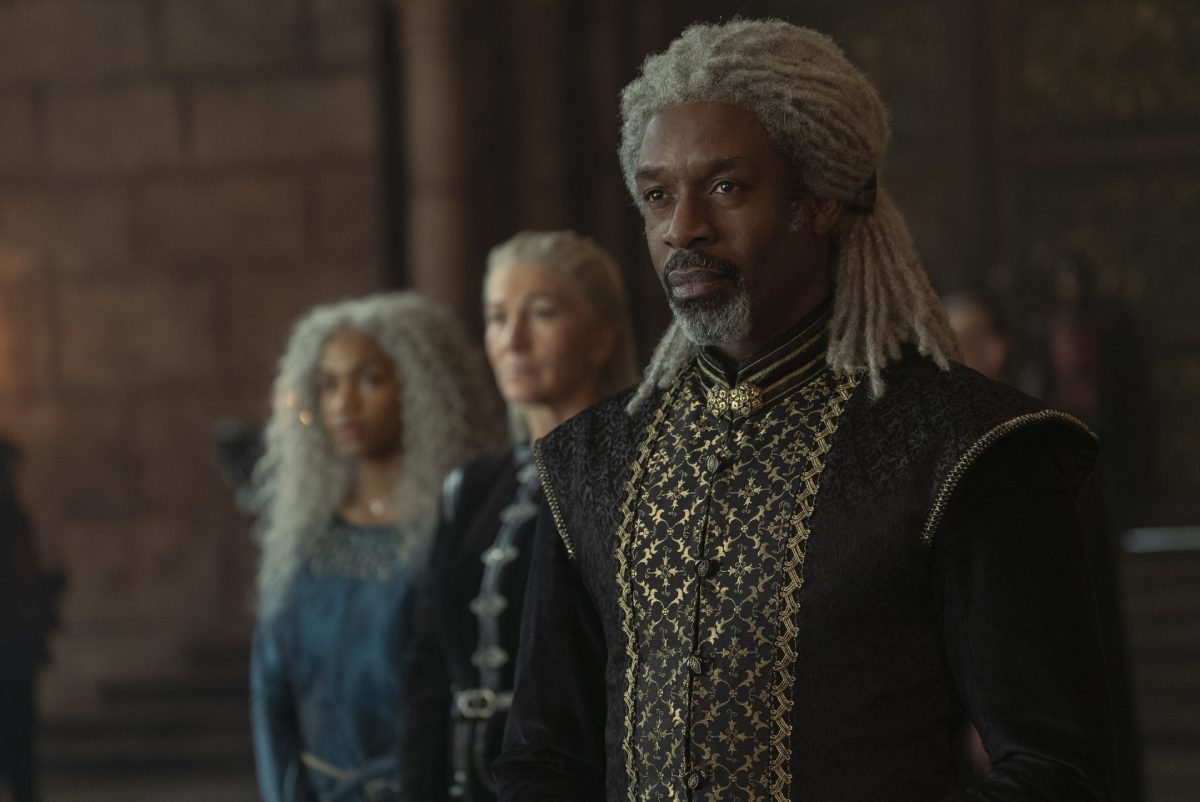 Wil Johnson as Vaemond Velaryon in House of the Dragon Episode 8. Vaemond stands in front of Rhaenys and Baela.