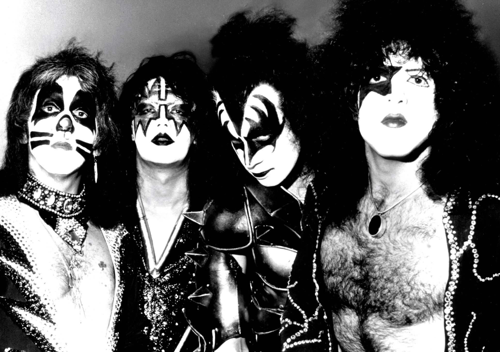 Peter Criss, Ace Frehley, Gene Simmons, and Paul Stanley of Kiss wearing makeup