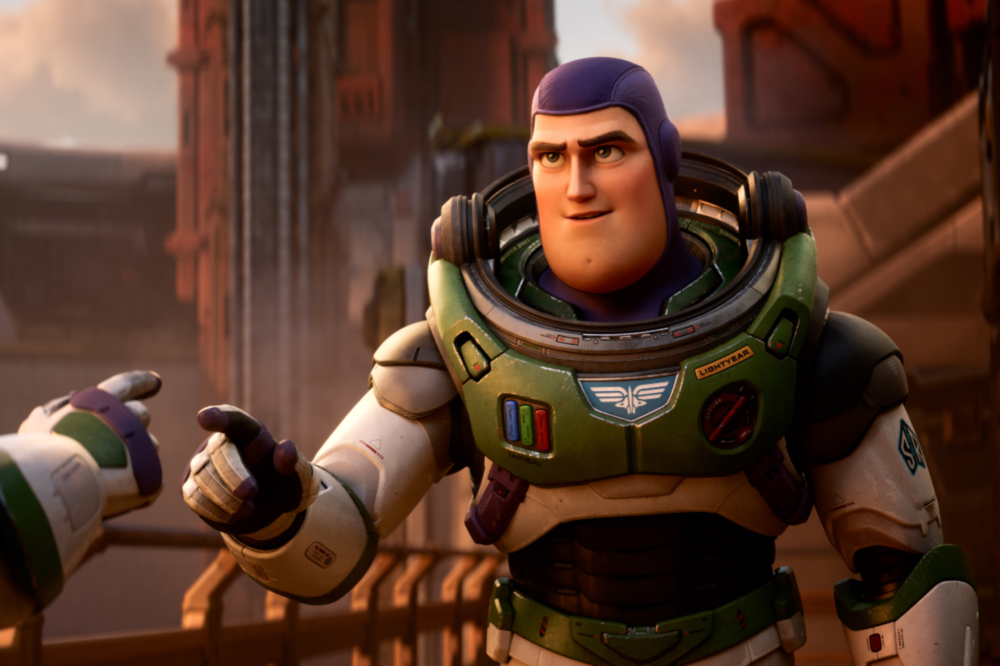 'Lightyear' Buzz Lightyear (voiced by Chris Evans) wearing his space suit and holding out his finger to touch another person's finger.