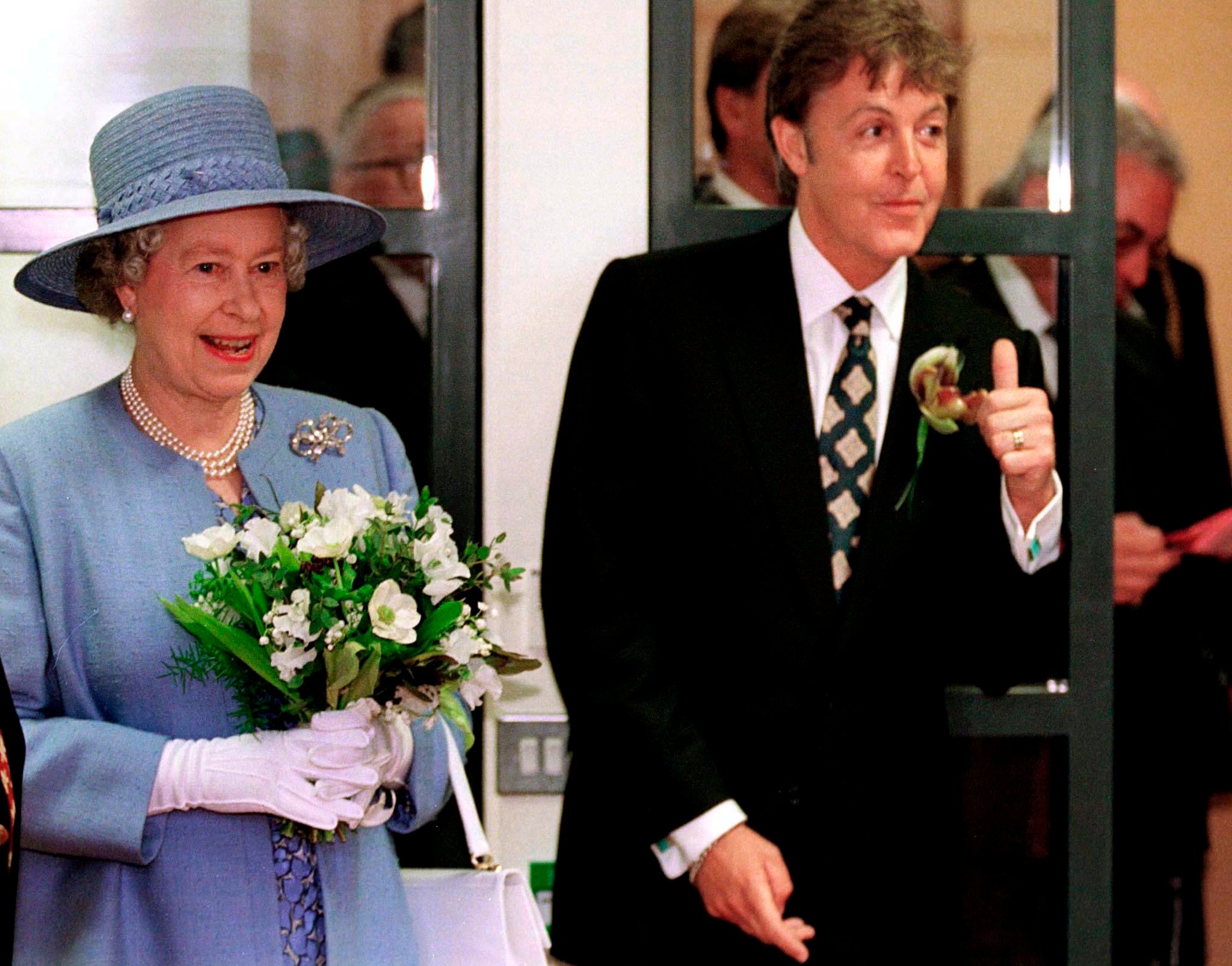 Queen Elizabeth with Paul McCartney at the Liverpool Institute for Performing Arts