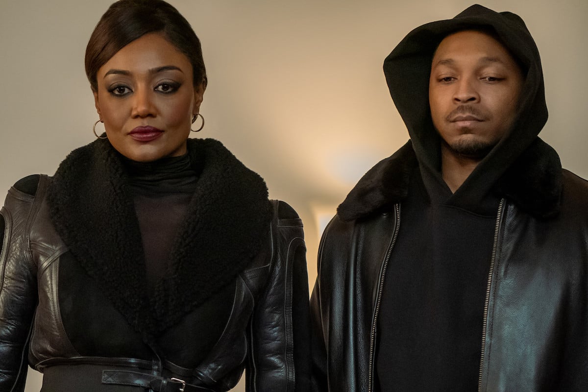 Patina Miller as Raq Thomas and Malcom Mays as Lou Thomas dressed in all black in 'Power Book III: Raising Kanan'