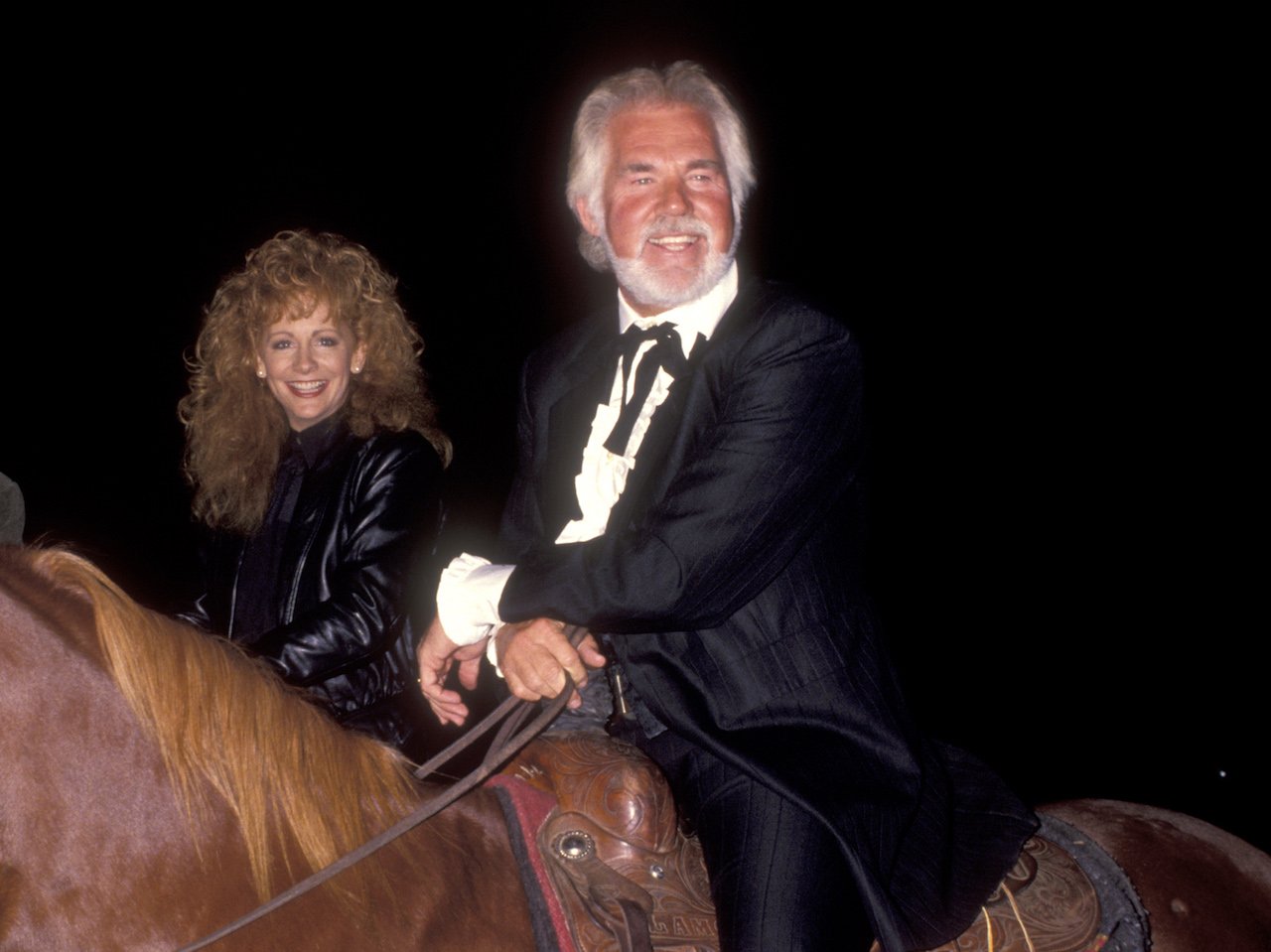 Reba McEntire and Kenny Rogers attend "The Gambler Returns: The Luck of the Draw" North Hollywood Screening on October 14, 1991.