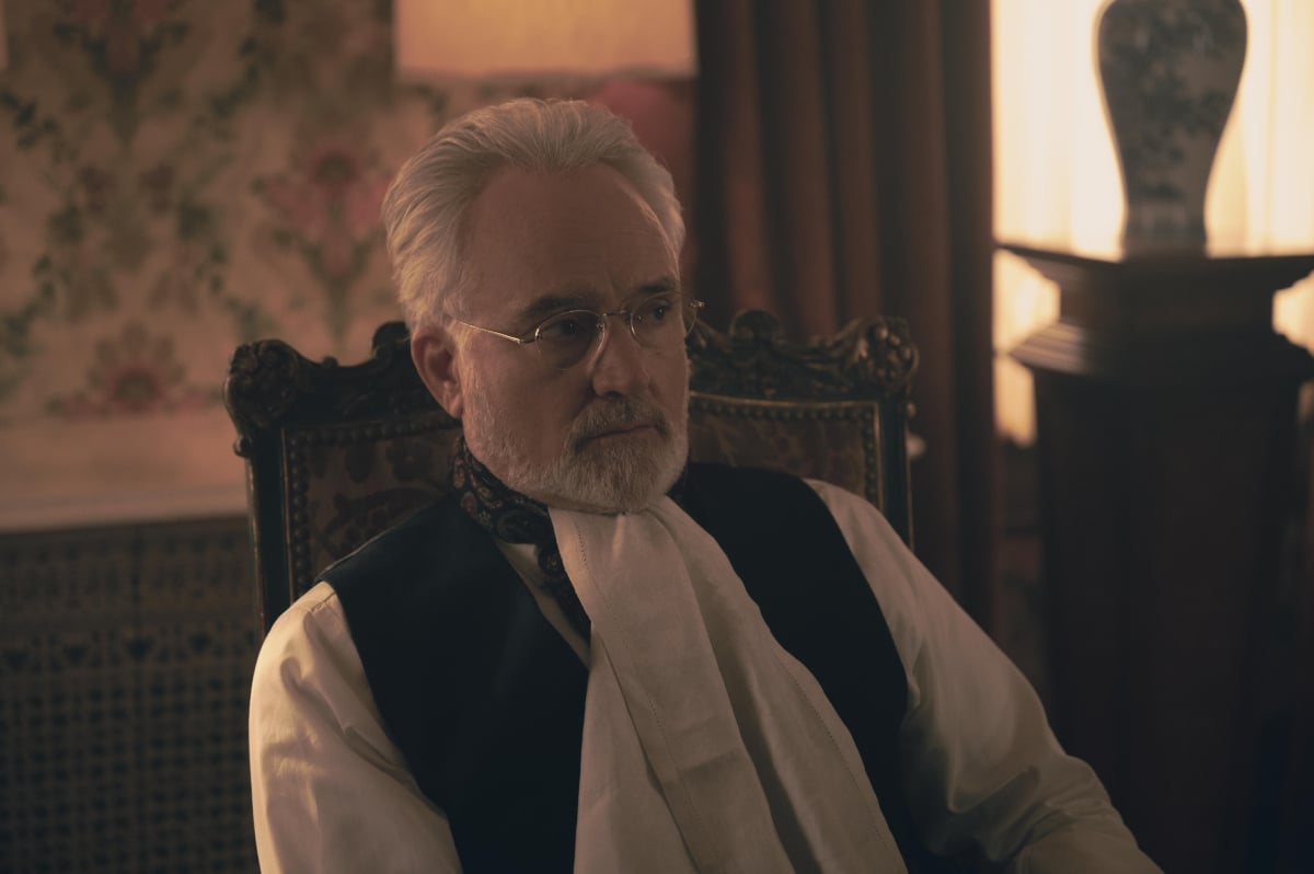 What is New Bethlehem in The Handmaid's Tale? Commander Lawrence sits in a chair.  