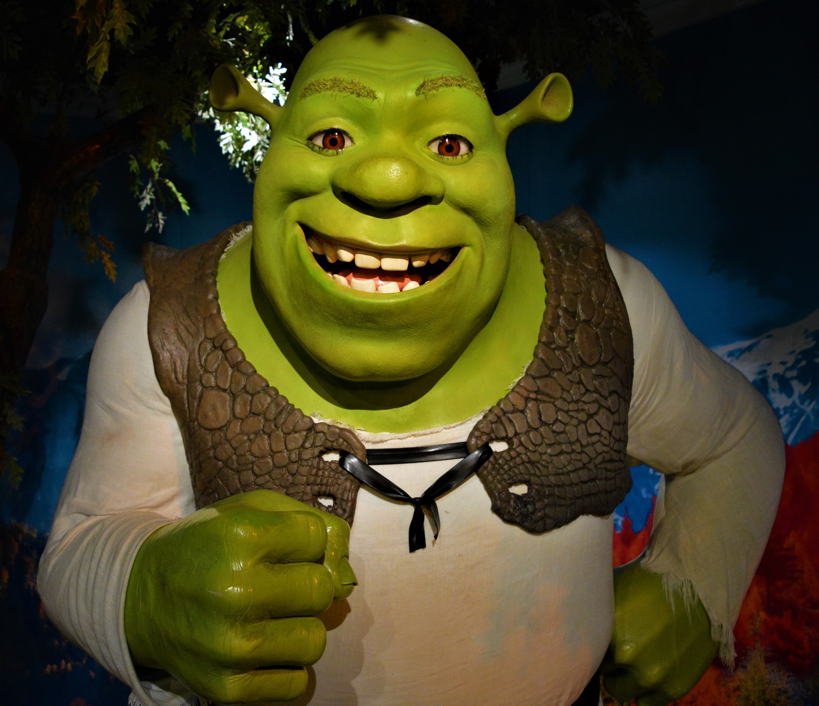 A wax figure of Shrek smiling