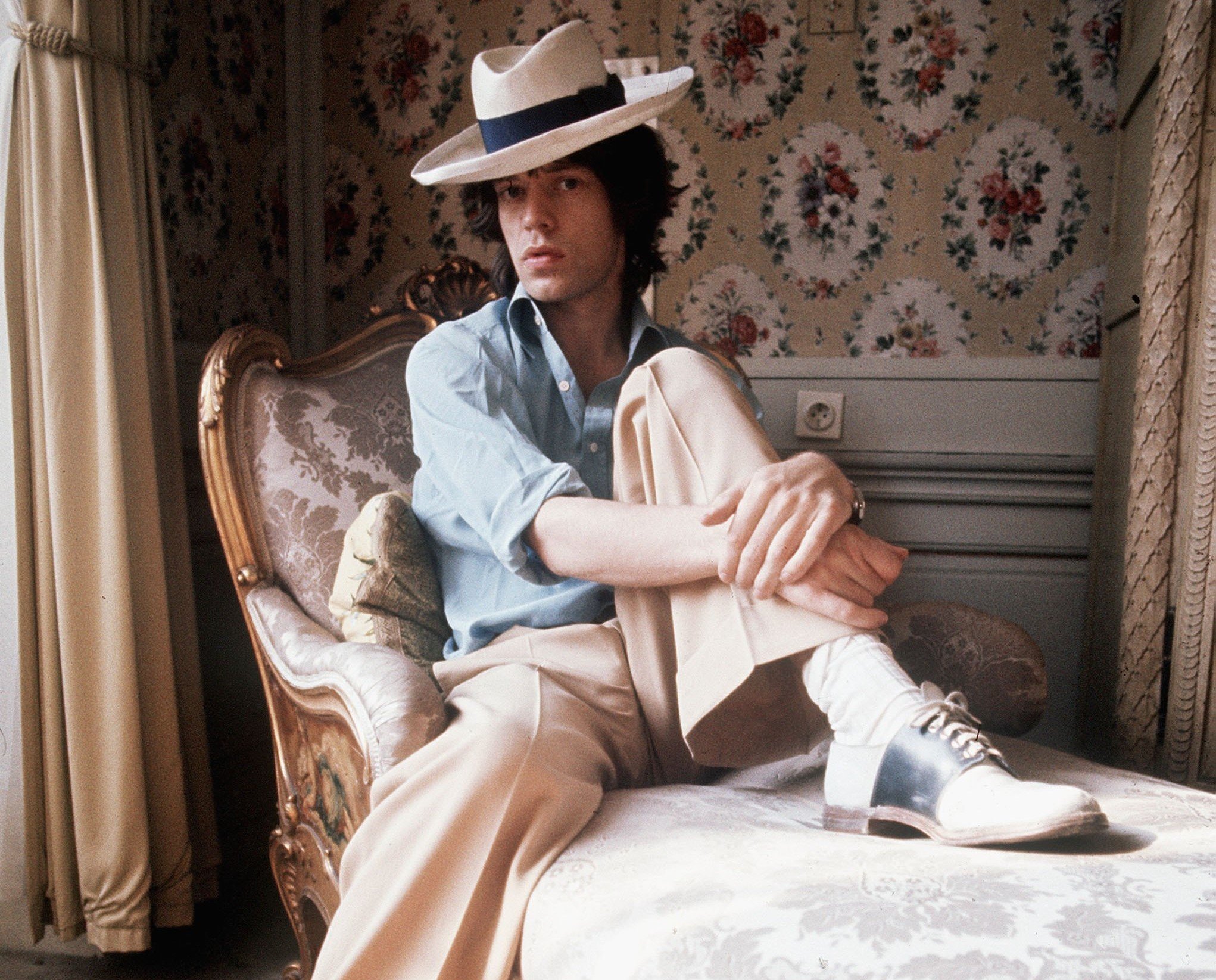 The Rolling Stones' Mick Jagger on a bed