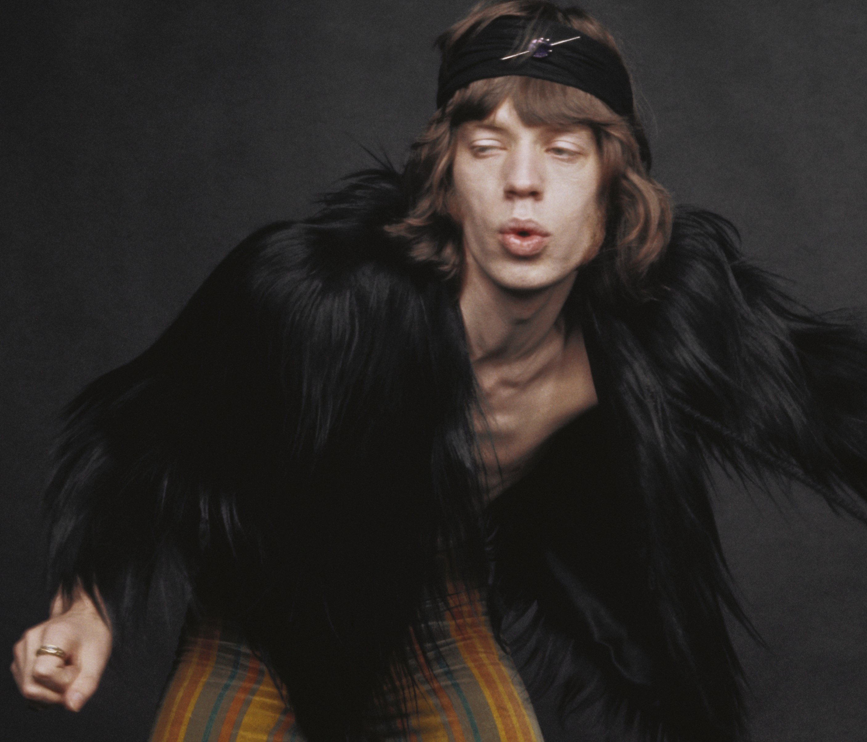 The Rolling Stones' Mick Jagger wearing fur