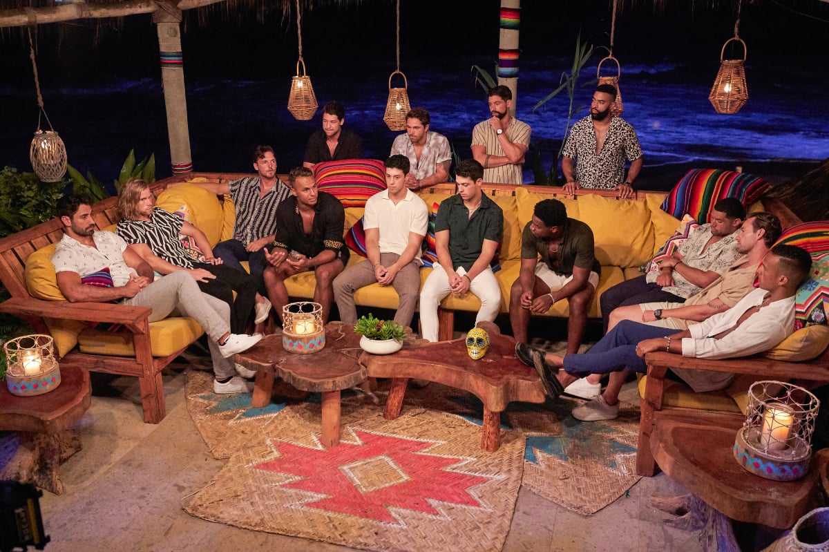 On Bachelor in Paradise 2022, the male contestants sit around a couch before the fourth rose ceremony. 