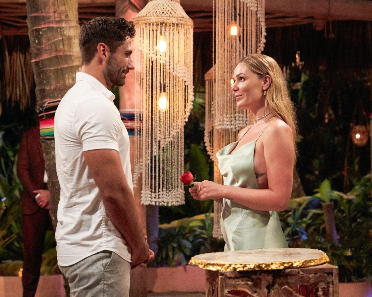 On Bachelor in Paradise 2022, Alex Bordyukov is presented with a rose by Florence Alexandra. 