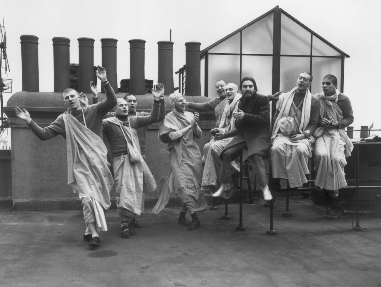 George Harrison on the roof of Apple Headquarters with members of the Hare Krishna Temple in 1970.