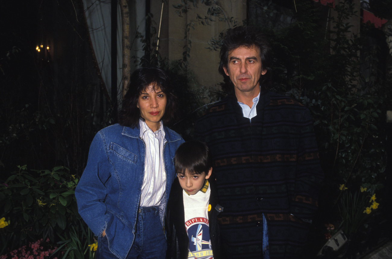 George Harrison with his wife, Olivia, and their son, Dhani, posing in Paris, 1988.