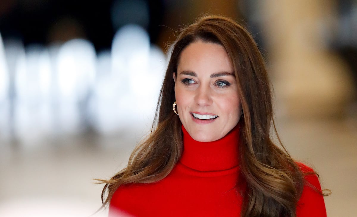 Kate Middleton, who appeared 'direct and assertive' in a video for Addiction Awareness Week, according to a body language expert, smiles and looks on wearing a red turtleneck