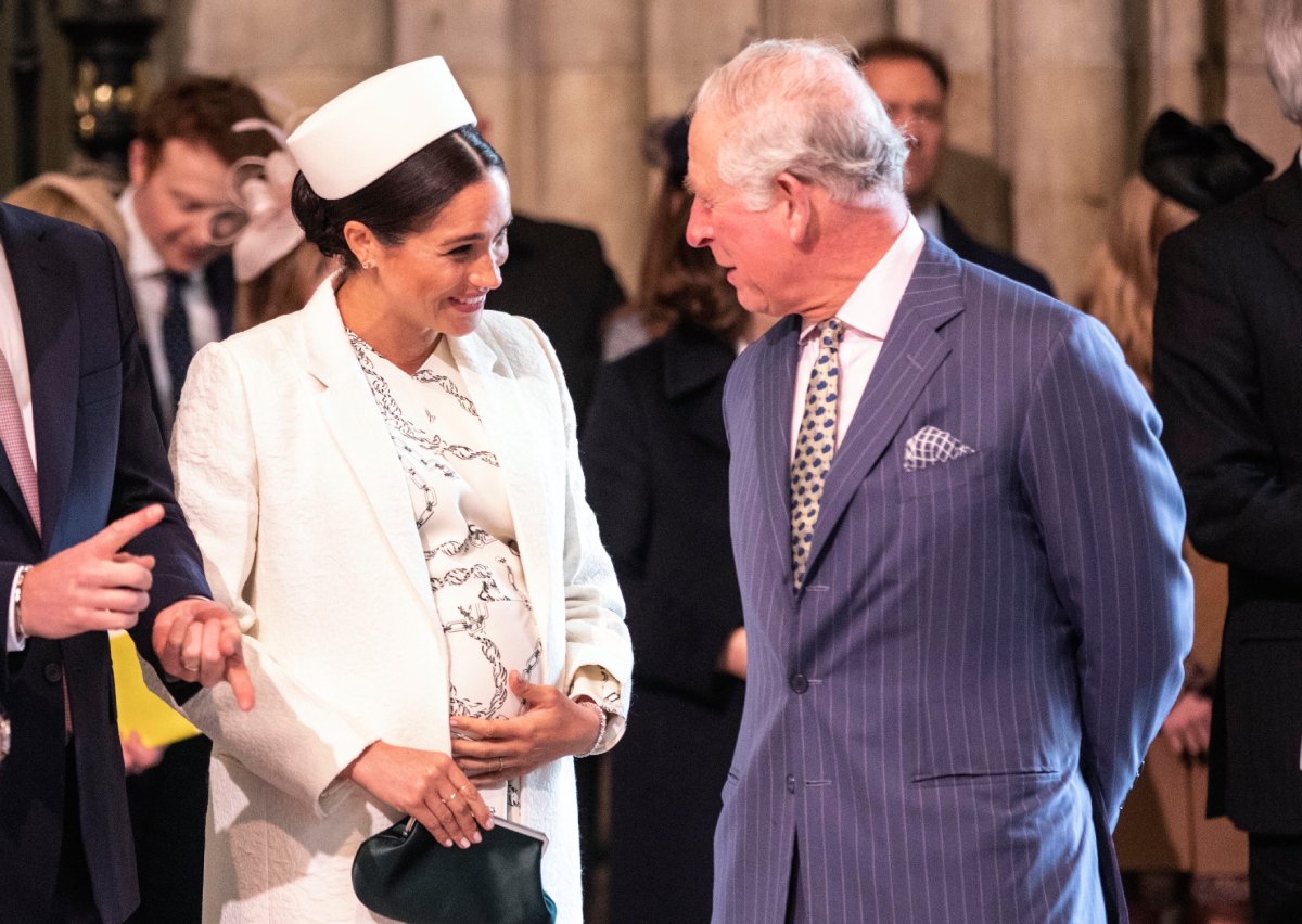 A pregnant Meghan Markle, Duchess of Sussex talks with King Charles — then Prince Charles at the Westminster Abbey Commonwealth day service on March 11, 2019 in London, England