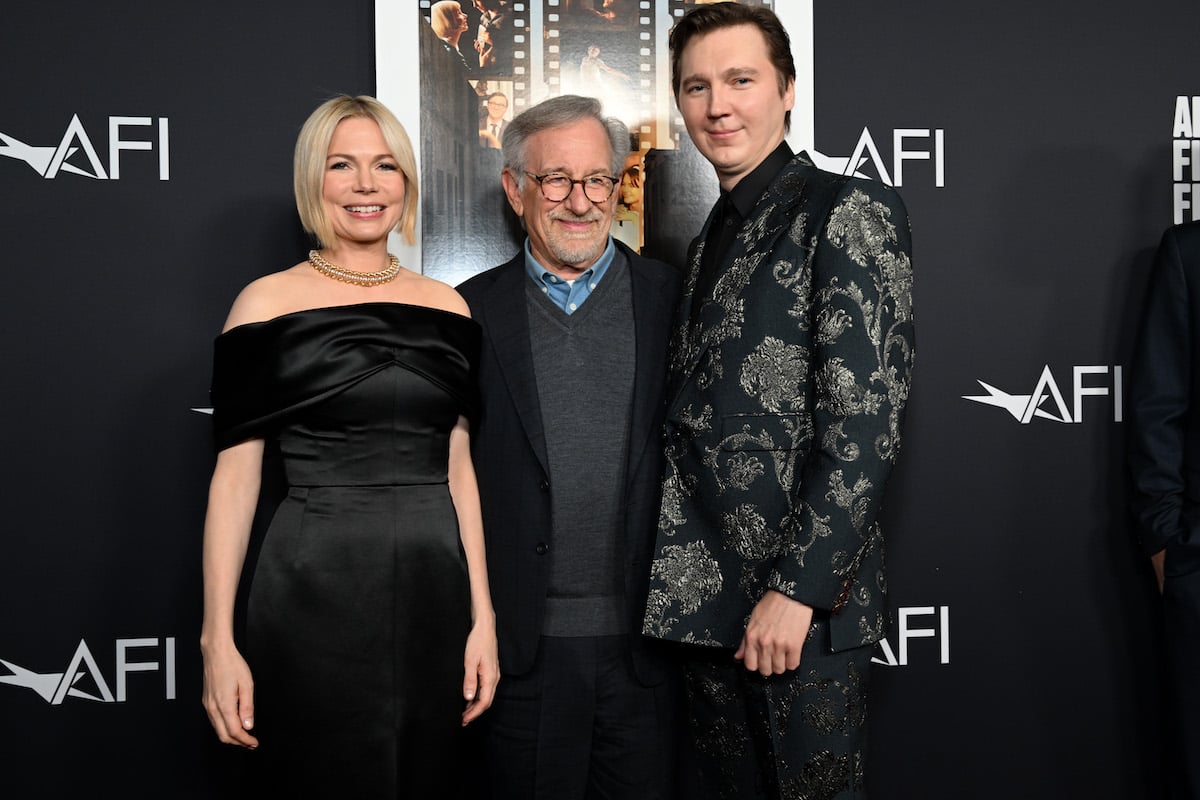 Michelle Williams, Steven Spielberg, and Paul Dano smile at thepremiere Of "The Fabelmans"