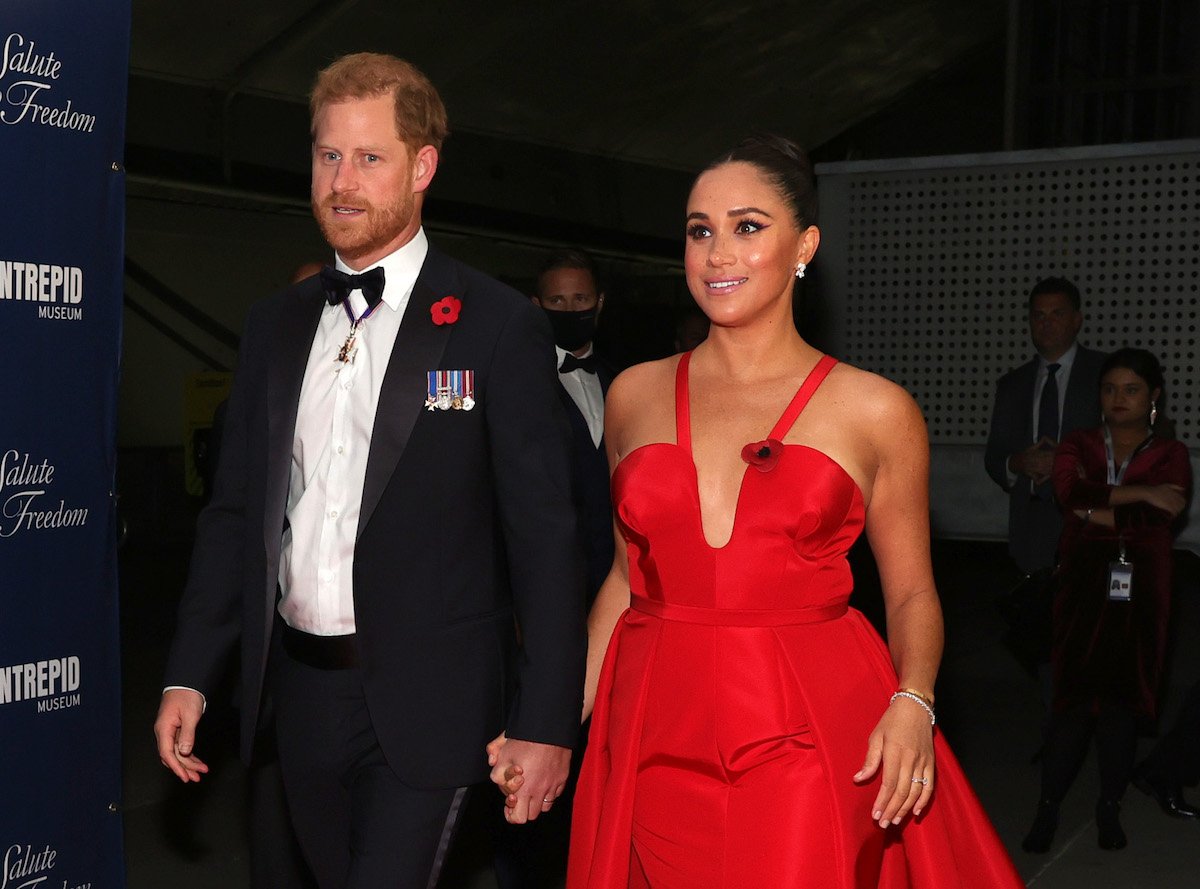 Prince Harry and Meghan Markle, who appeared in portraits taken by Ramona Rosales and, according to one royal fashion expert, make royal family portraits look 'outdated' in comparison, hold hands wearing a tuxedo and ball gown in 2021