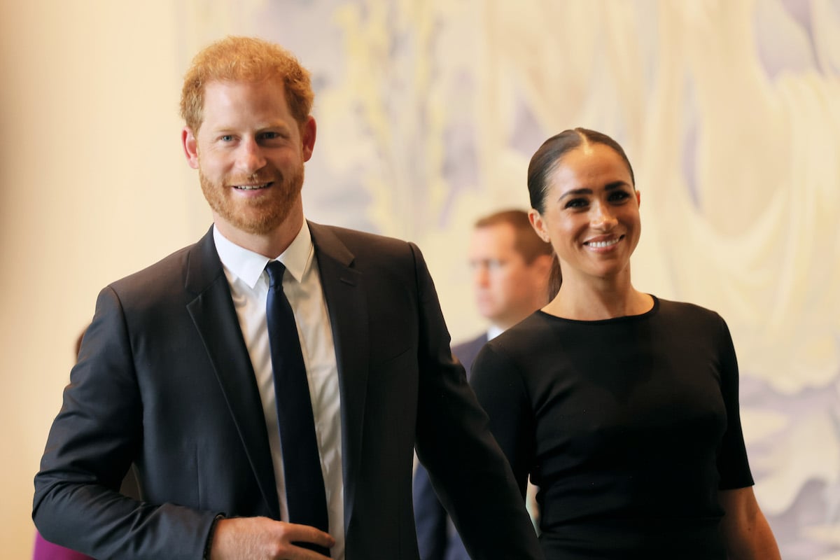 Prince Harry and Meghan Markle, who both had their photo taken by Ramona Rosales (Prince Harry for his 'Spare' cover and Meghan Markle for a Variety interview), smile and they walk together