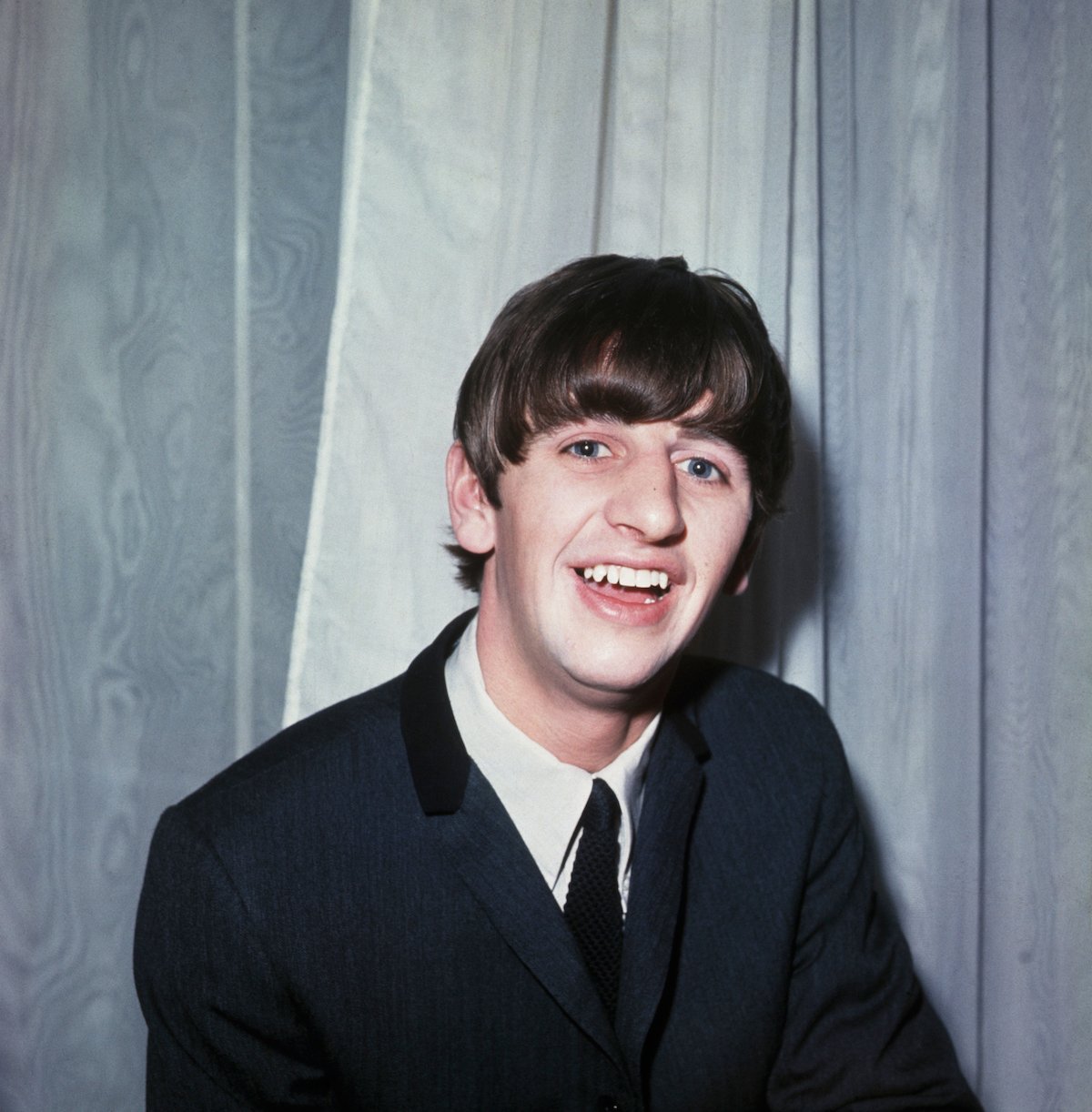 Ringo Starr smiles in a Beatles era photo