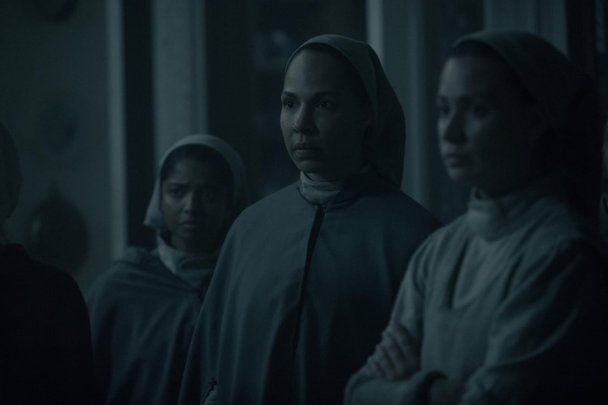 Marthas in The Handmaid's Tale wearing their gray dresses and hair covers. 