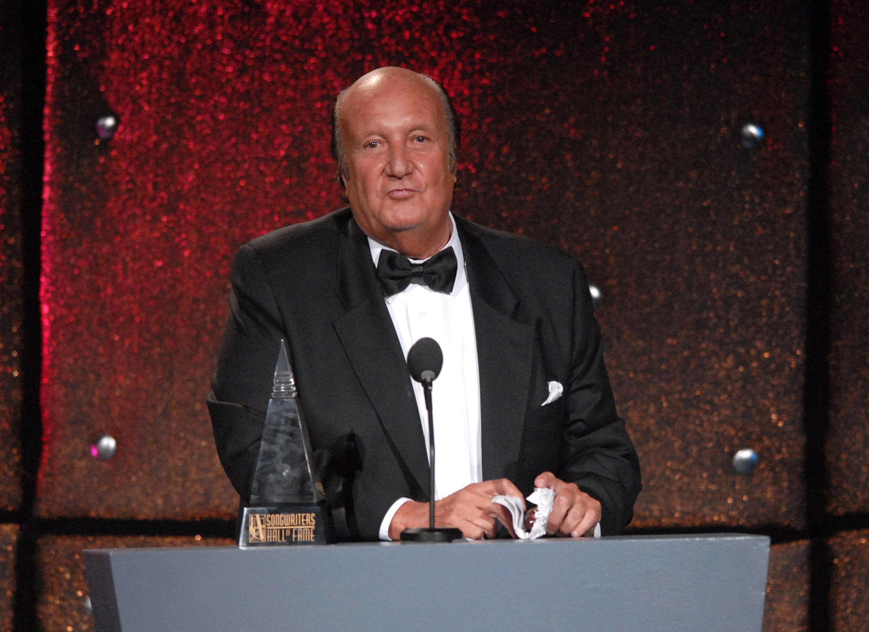 The Monkees' supervisor, Don Kirshner, at a podium