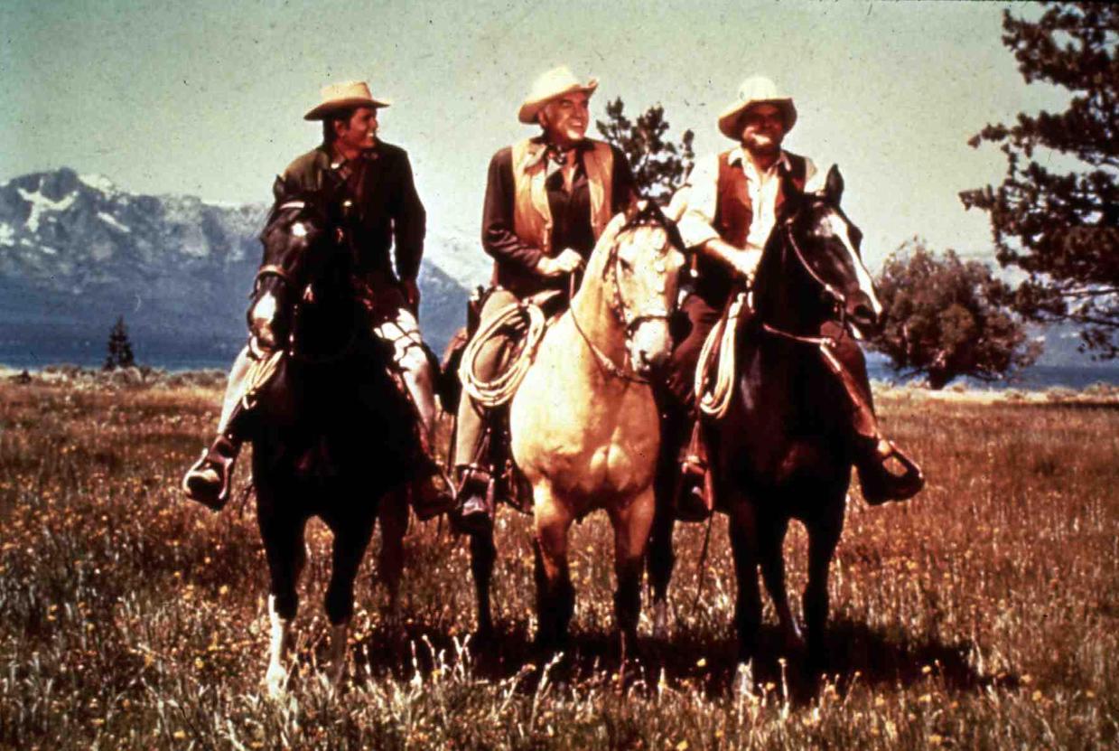 Michael Landon, Lorne Greene, and Dan Blocker in a row on horses in 'Bonanza'