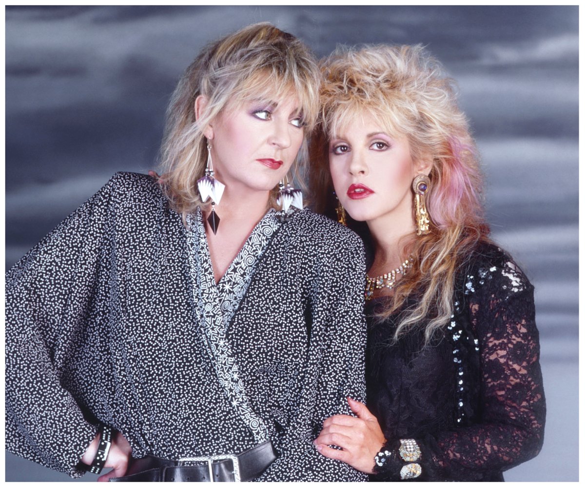 Christine McVie and Stevie Nicks pose together for a portrait.