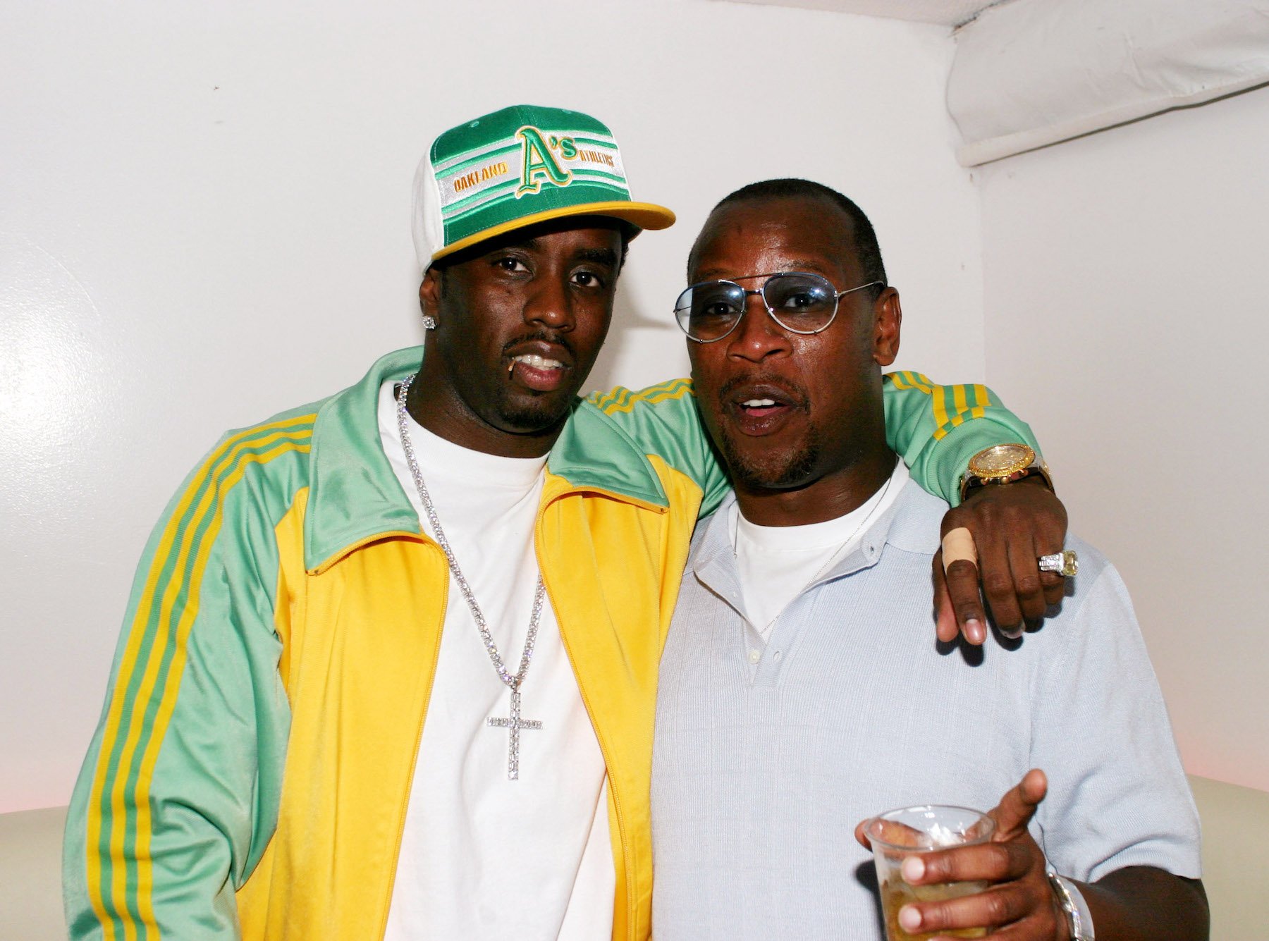Sean "P. Diddy" Combs and former Uptown Records CEO Andre Harrell posing for a photo together
