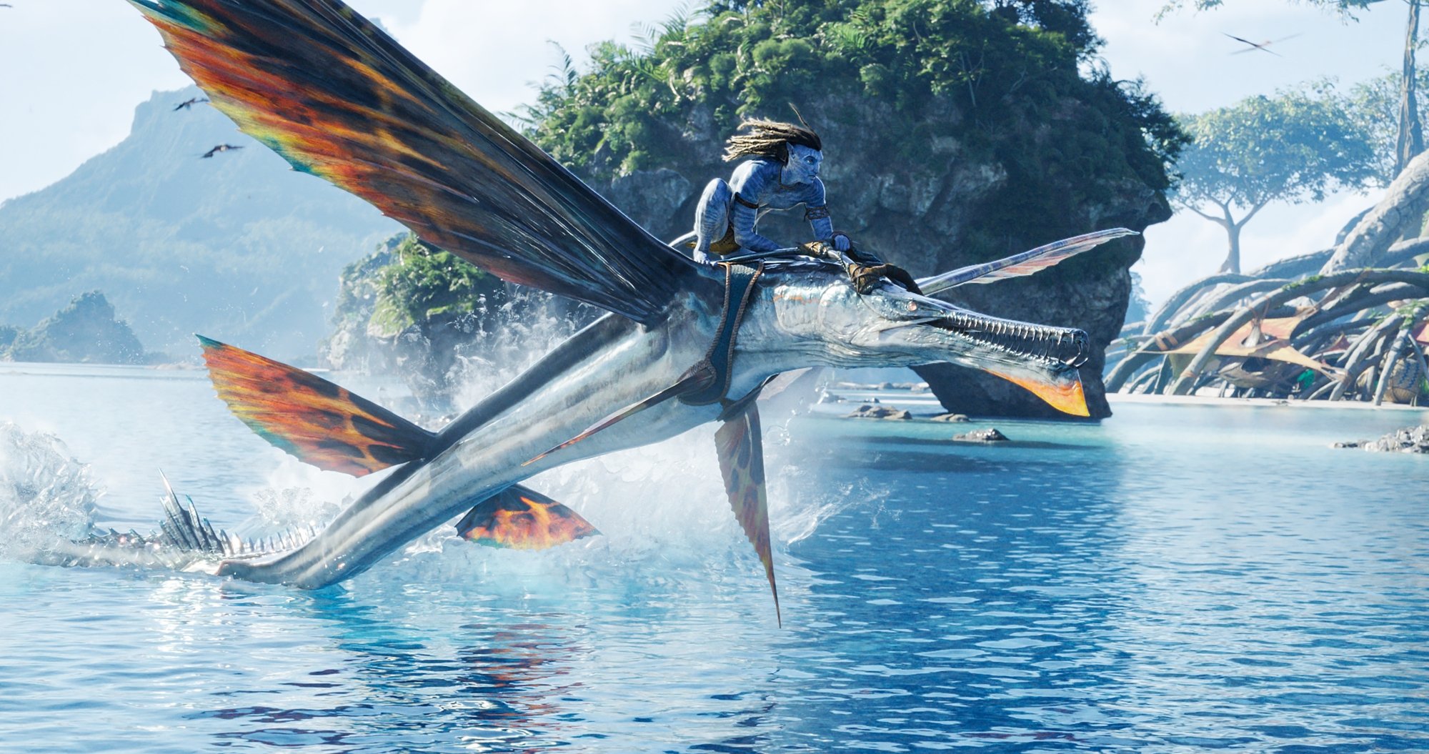 James Cameron's 'Avatar_"The Way of Water' Sam Worthington as Jake Sully riding a skimwing over the ocean water