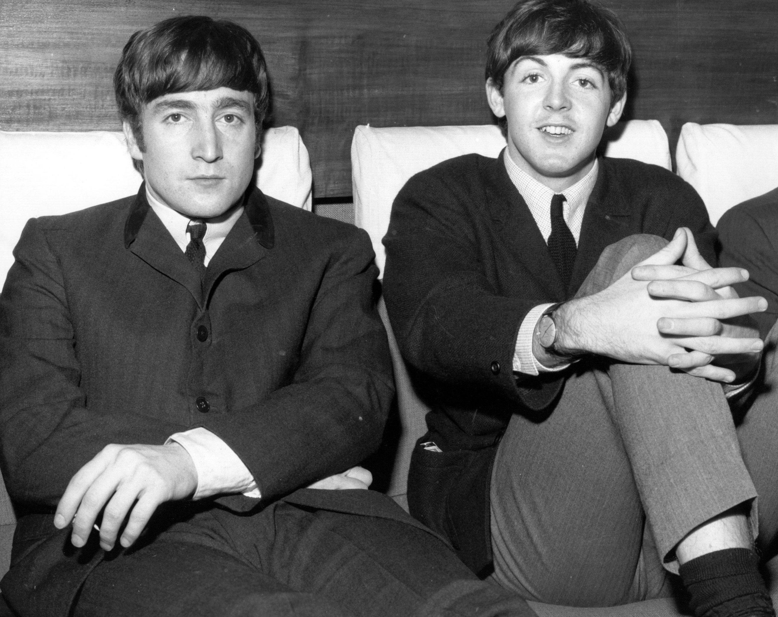 John Lennon and Paul McCartney wearing suits