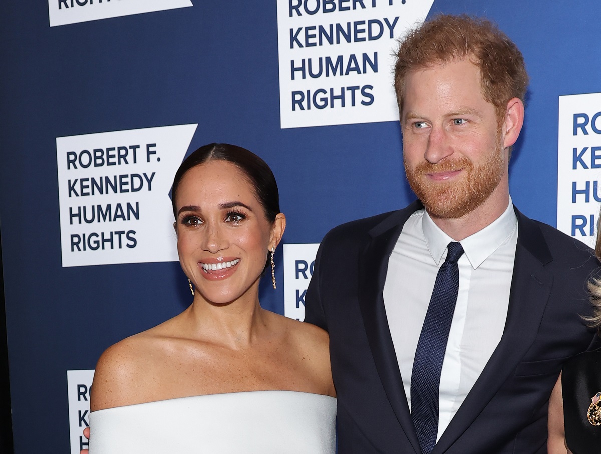 Meghan Markle and Pricne Harry smile on the carpet at the 2022 Robert F. Kennedy Human Rights Ripple of Hope Gala