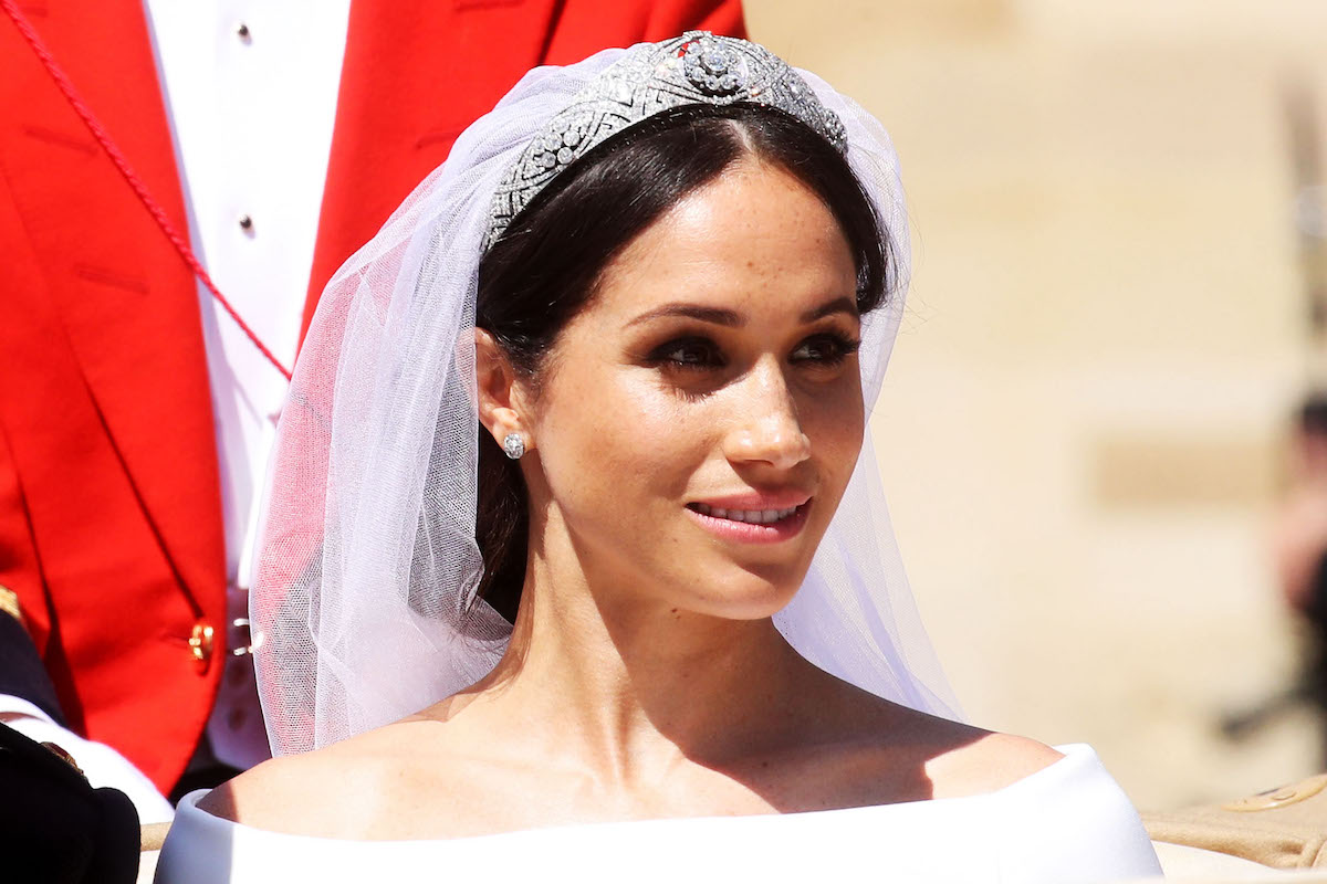 Meghan Markle in her wedding gown at her royal wedding to Prince Harry in 2018 before a wedding gown interview in which a body language expert said her 'mask slipped'