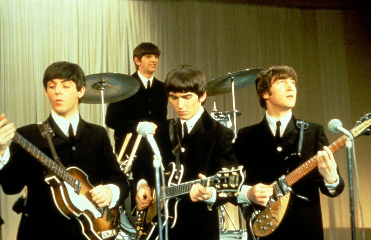 The Beatles: John Lennon, Paul McCartney, Ringo Starr and George Harrison play on stage