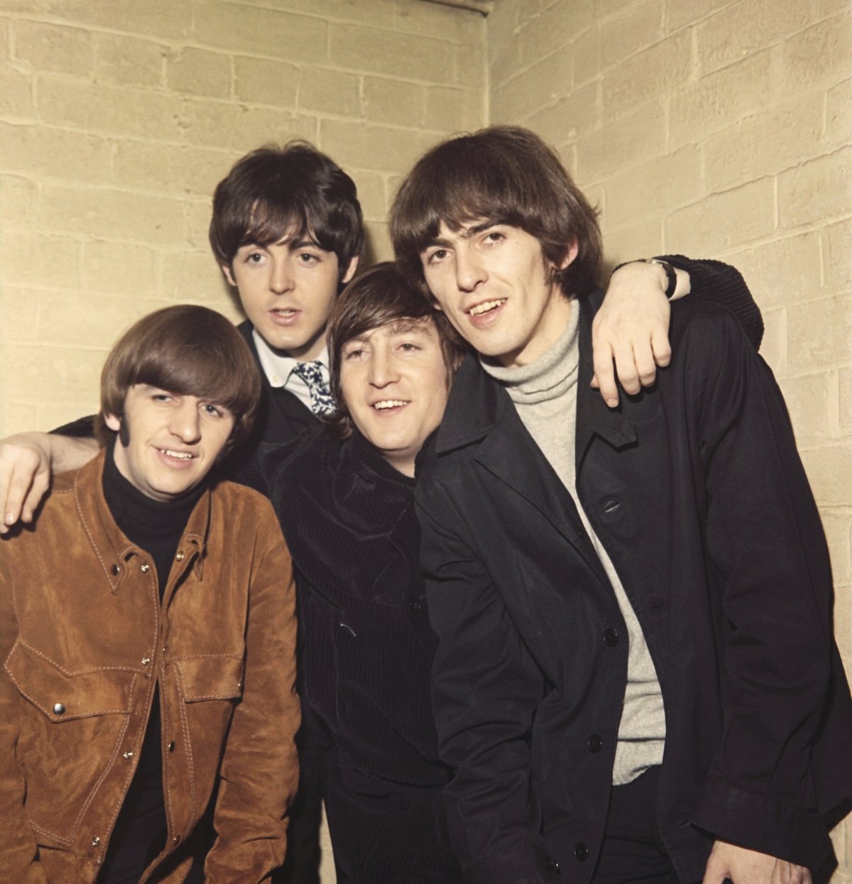 The Beatles: Paul McCartney puts his arms around Ringo Starr, John Lennon and George Harrison