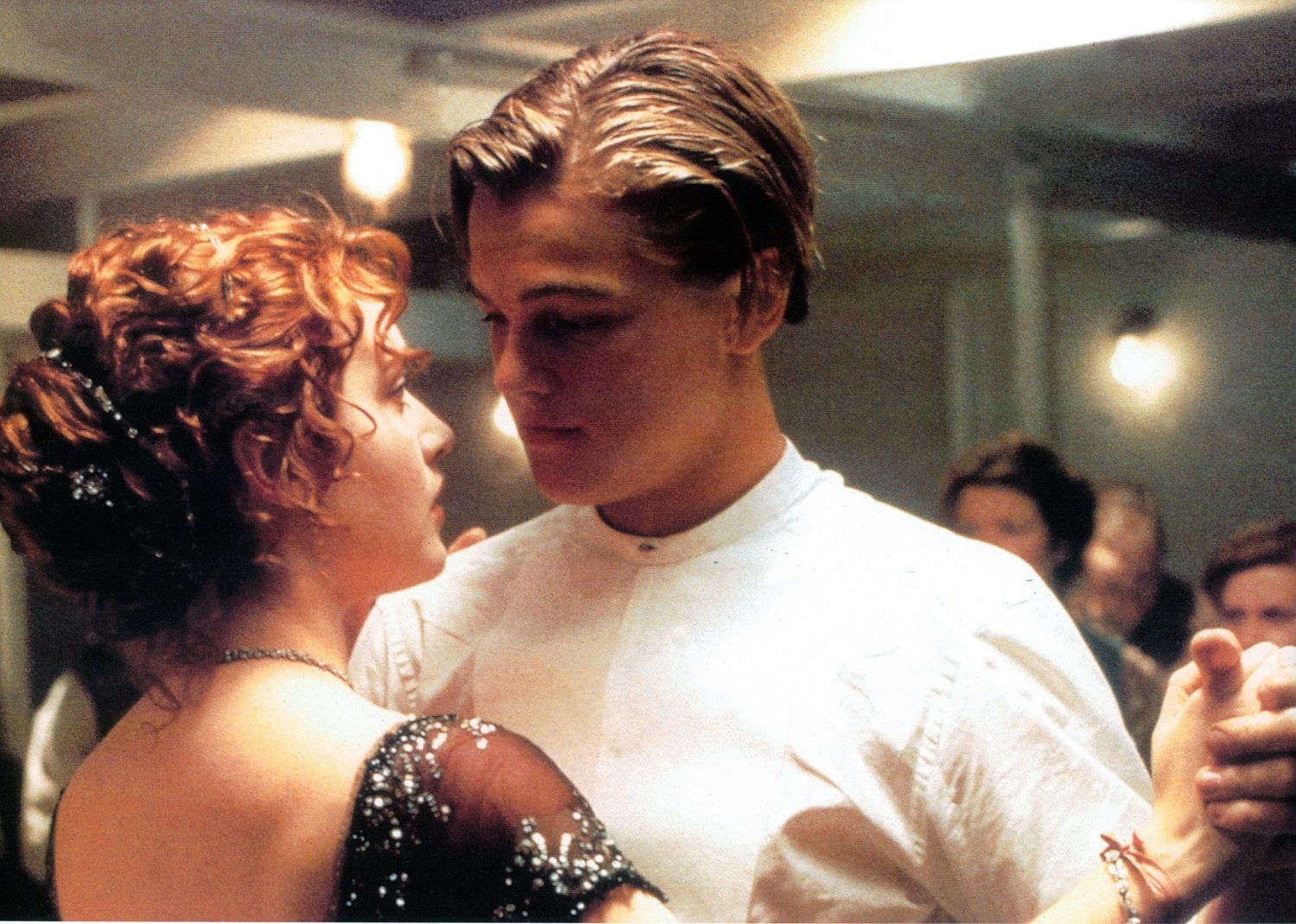 Kate Winslet and Leonardo DiCaprio dancing in a scene from the film 'Titanic',