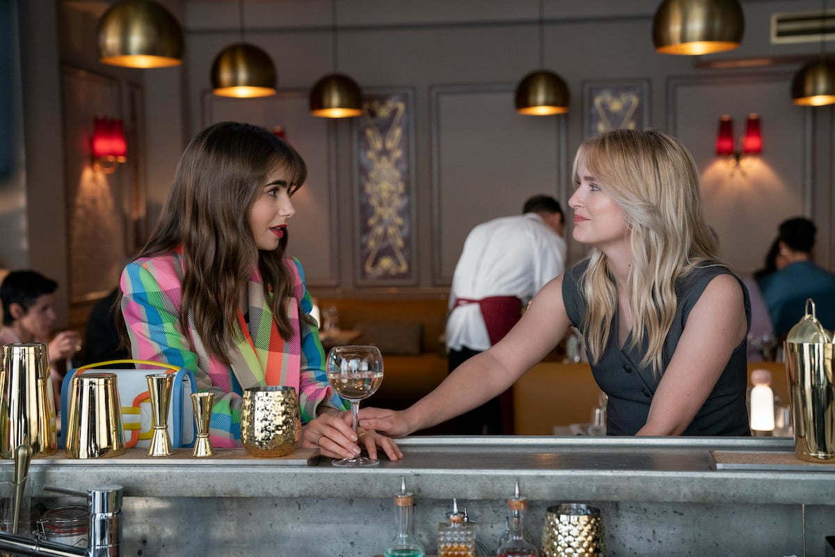 Emily Cooper (Lily Collins) talks with Camille (Camille Razat) in 'Emily in Paris' Season 3 on Netflix