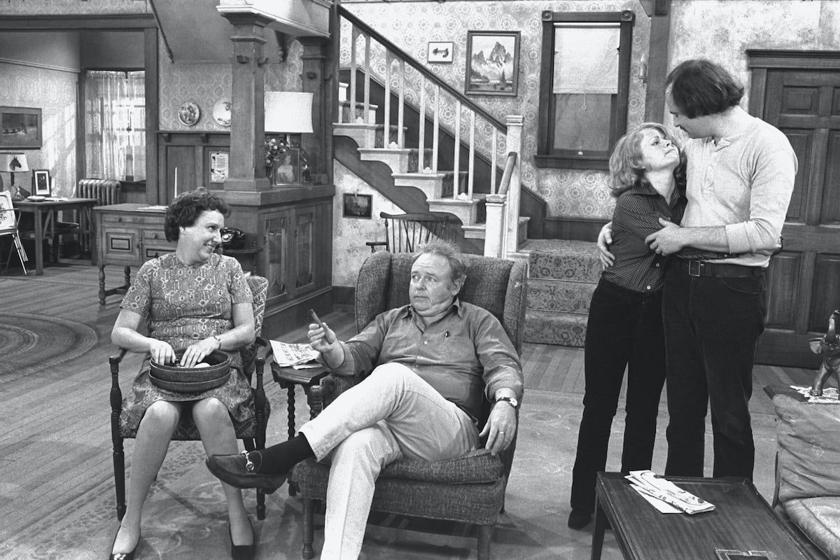 Black and white photo of the 'All in the Family' cast on the show's set