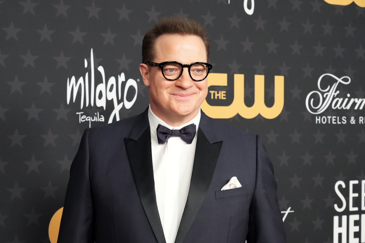 Brendan Fraser poses for photos in front of a black backdrop at the 28th Annual Critics Choice Awards