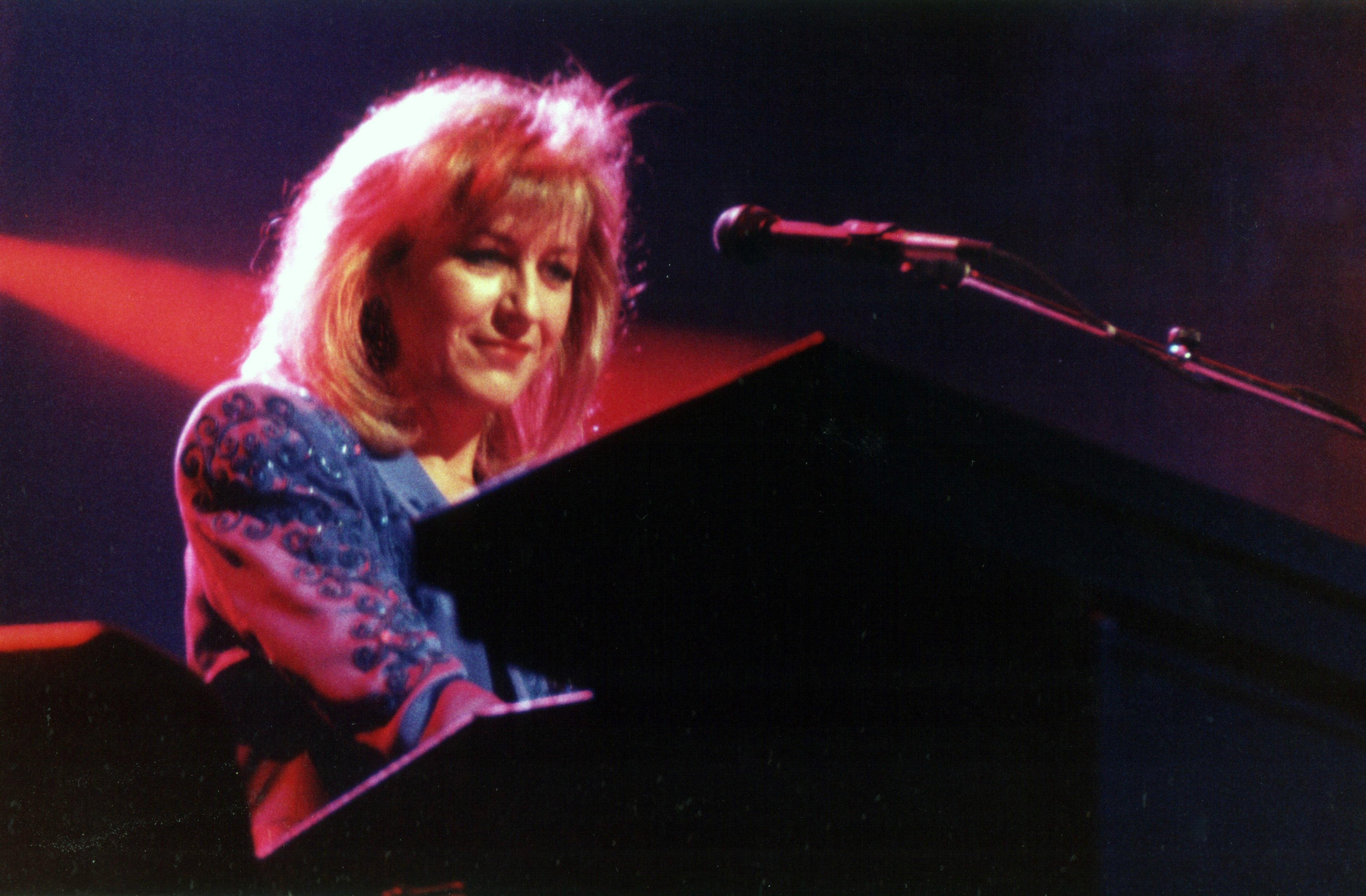 Christine McVie of Fleetwood Mac performs on stage.