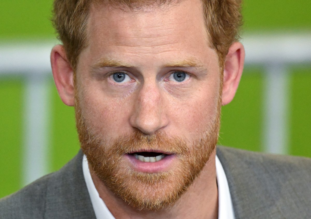 Prince Harry opens his mouth and looks into the camera.