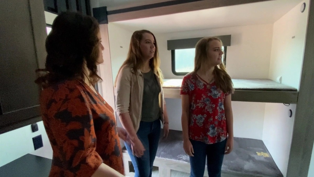 Robyn Brown, Aurora Brown, and Breanna Brown look around Janelle Brown's fifth-wheel trailer on ‘Sister Wives’ Season 17 on TLC.