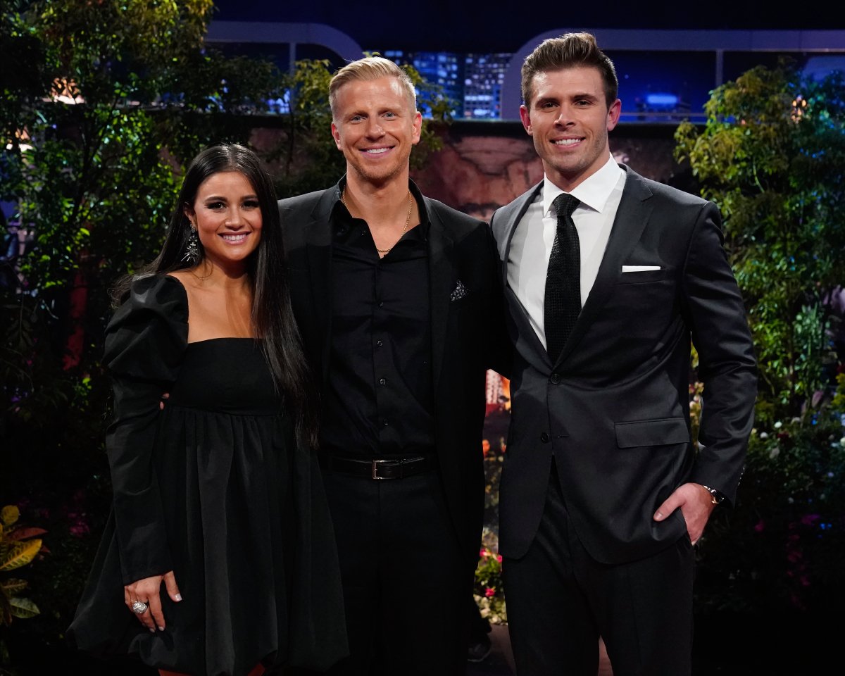 The Bachelor 2023 lead Zach Shallcross poses for a photo with Catherine Guidici and Sean Lowe during the After the Final Rose special. 