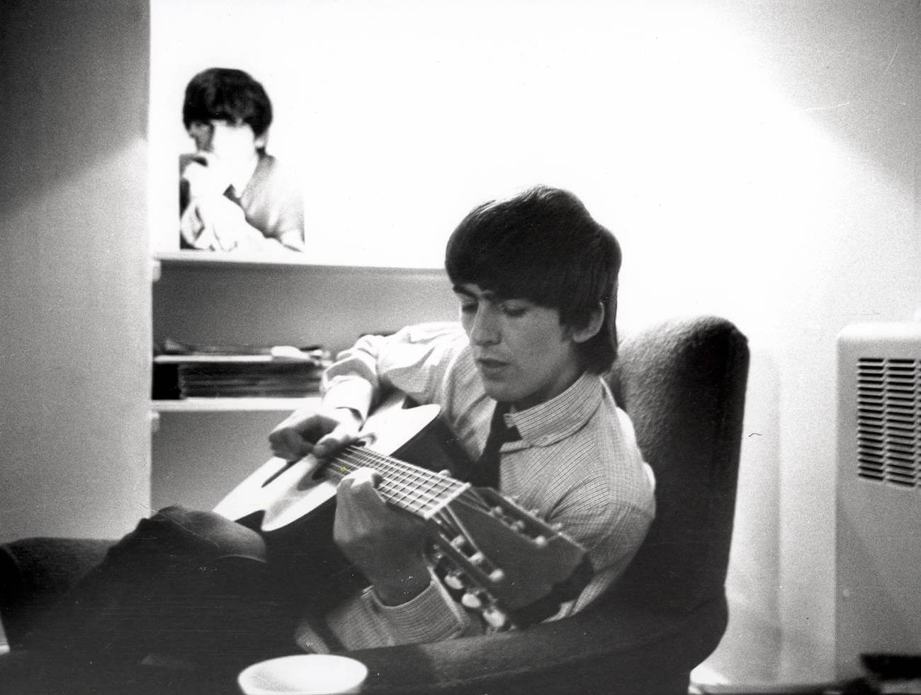 George Harrison backstage during the filming of 'A Hard Day's Night' in 1964. 