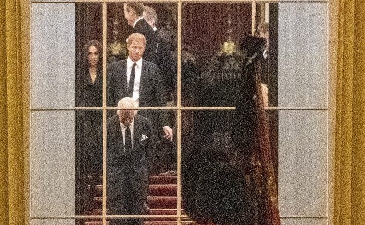 King Charles III, Prince Harry, and Meghan Markle inside Buckingham Palace as they wait for Queen Elizabeth II's coffin to arrive