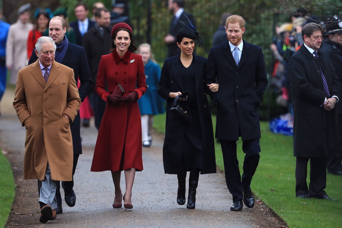 King Charles, who has a 'much easier path' to reconciliation, according to an expert, walks with Prince William, Kate Middleton, Meghan Markle, Prince Harry