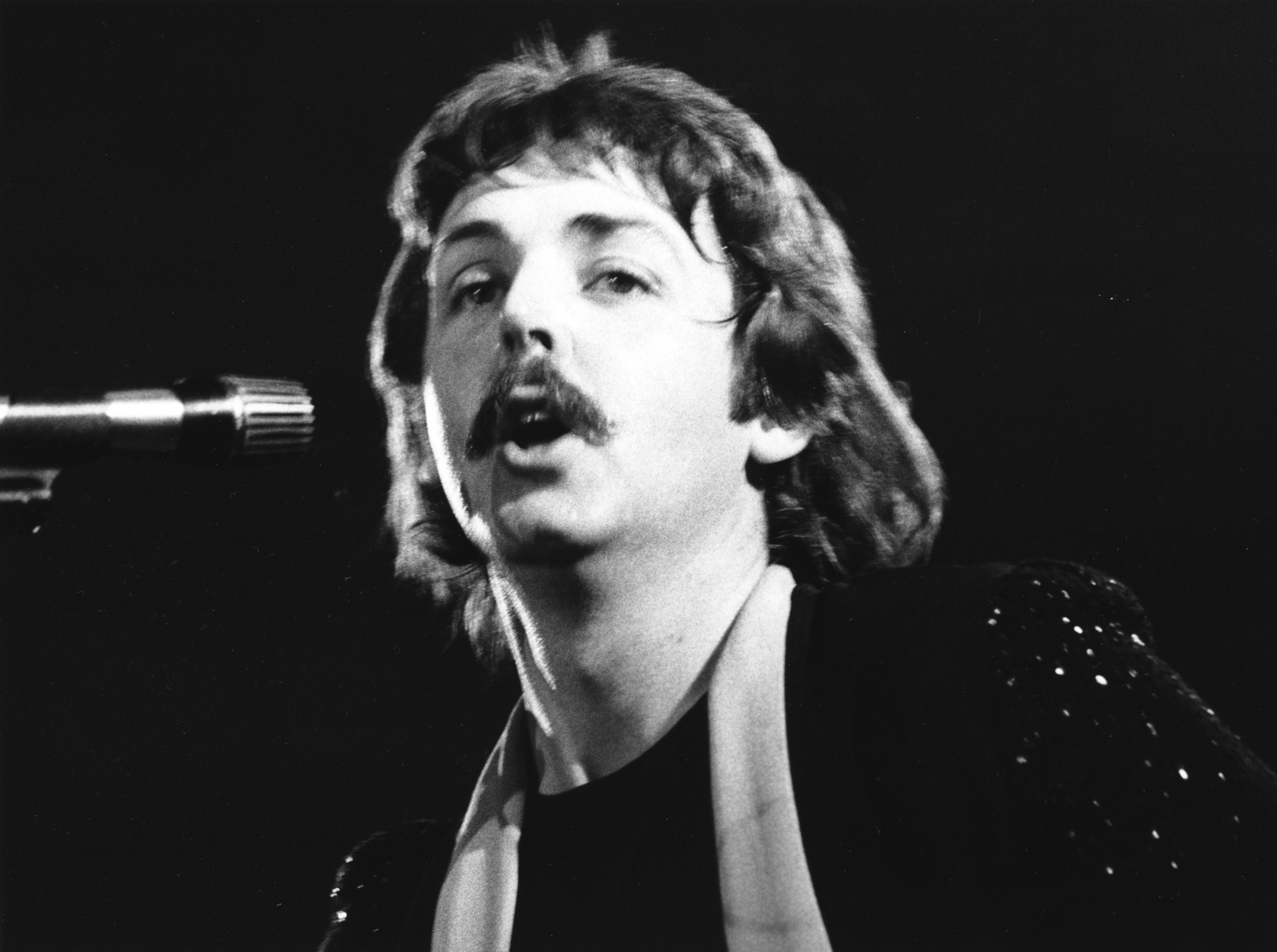 Paul McCartney performs with Wings in 1976