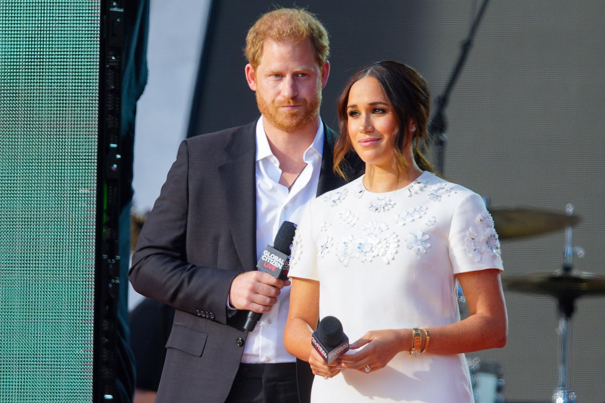 Prince Harry and Meghan Markle, who released an Archewell Foundation impact report, look on