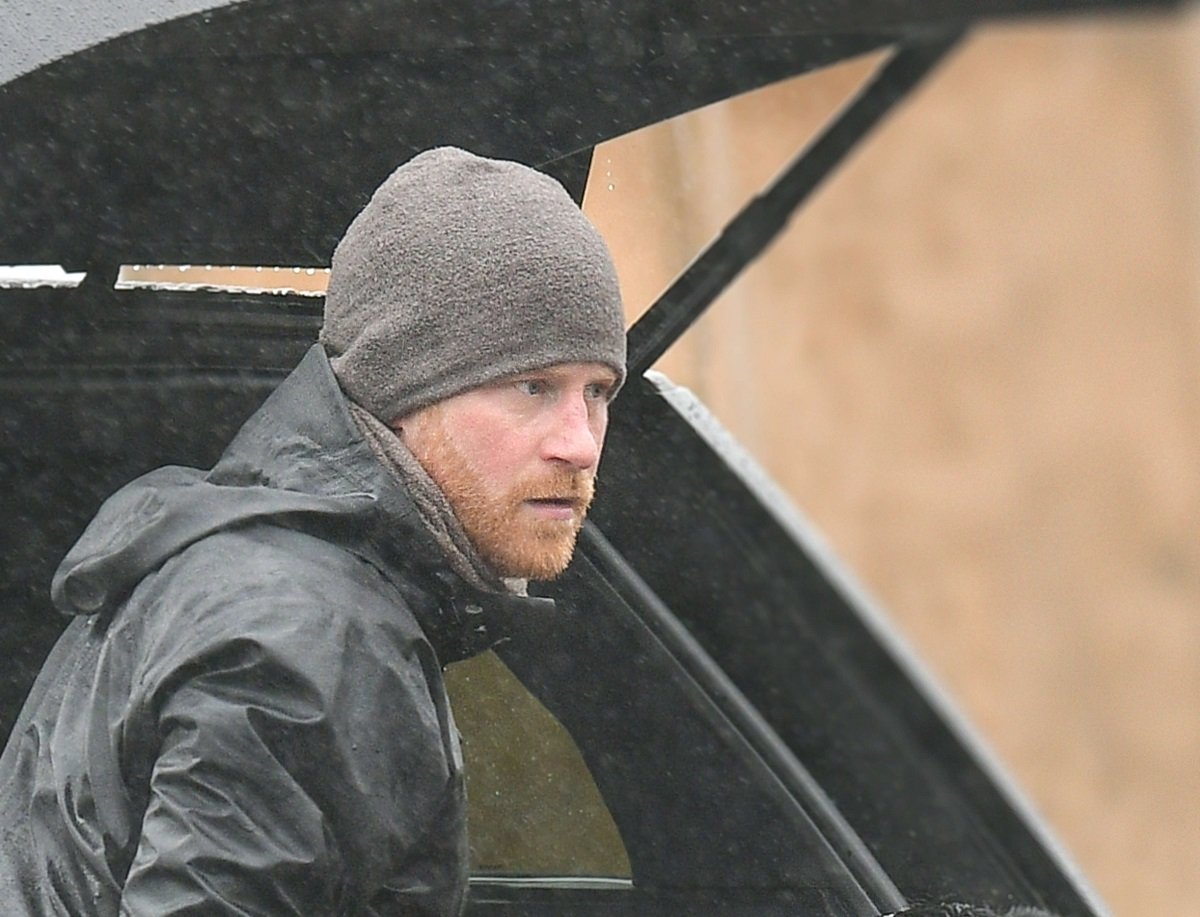 Prince Harry is seen on a rainy day with his dog in Montecito, California