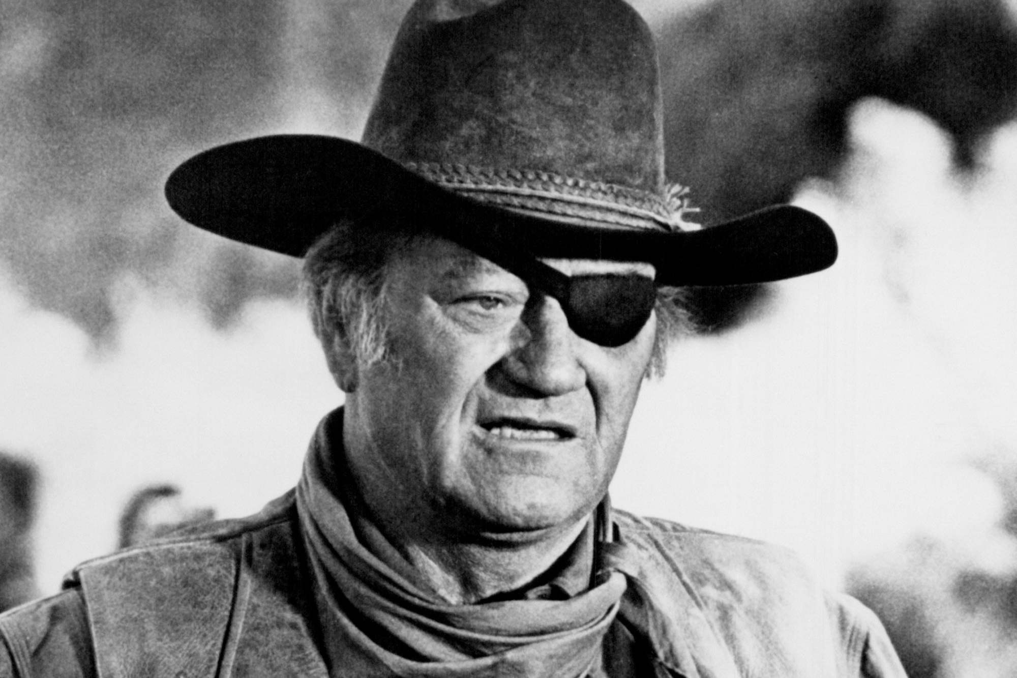 'Rio Bravo' star John Wayne playing Rooster Cogburn in 'Rio Bravo' with his mouth slightly opened wearing an eye patch and Western hat